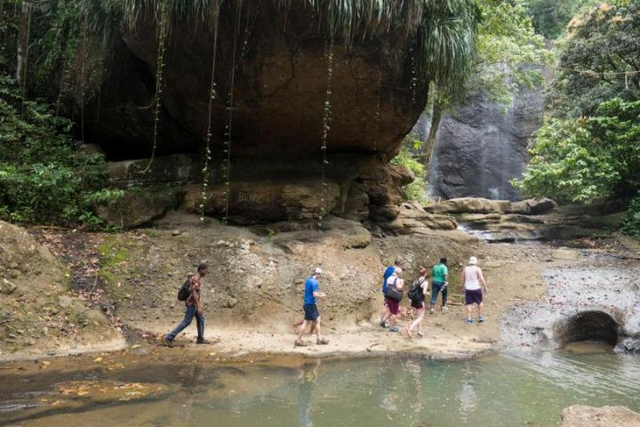 Walking through the river waterfall