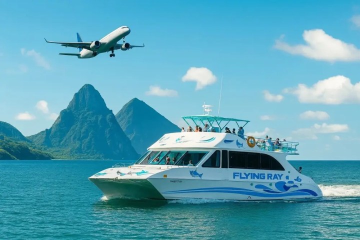 Boat on water with plane flying over mountains in background.