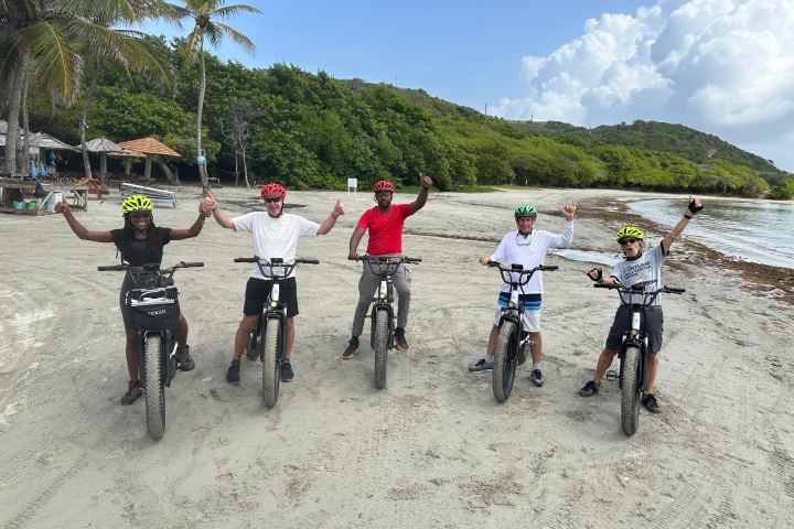 E-bike riders exploring the luxurious Cap Estate neighborhood in St. Lucia