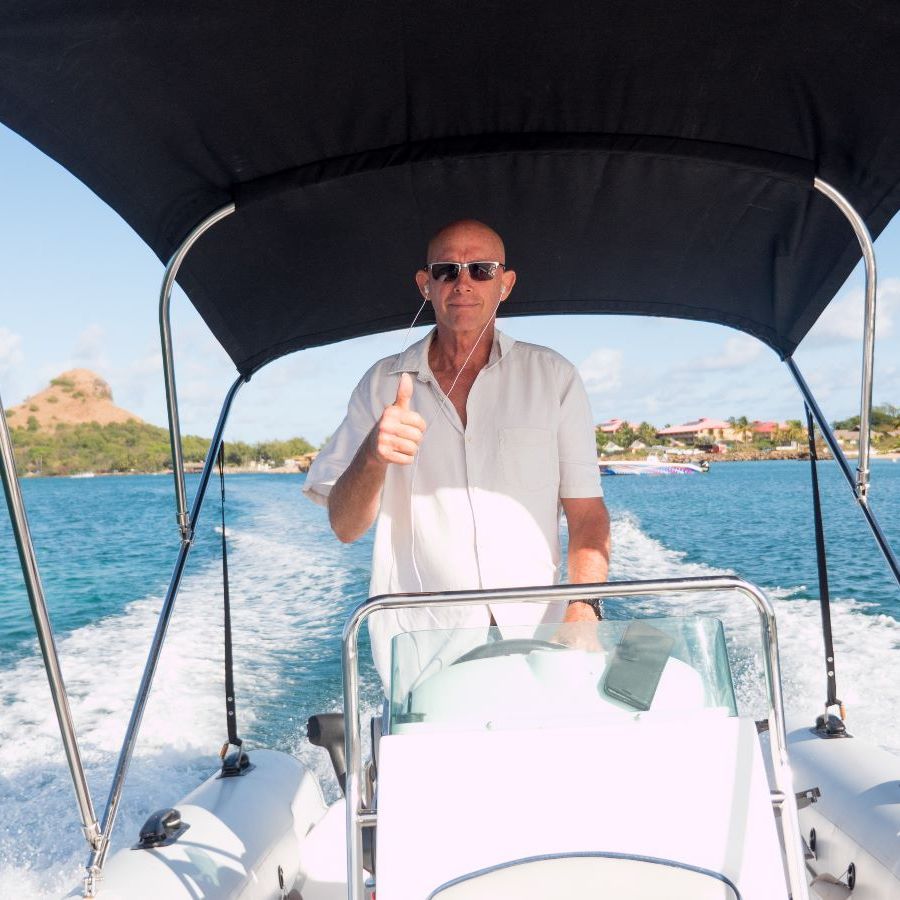 adventure-tours-st-lucia-owner-bryan Owner of Adventure Tours St Lucia driving a boat
